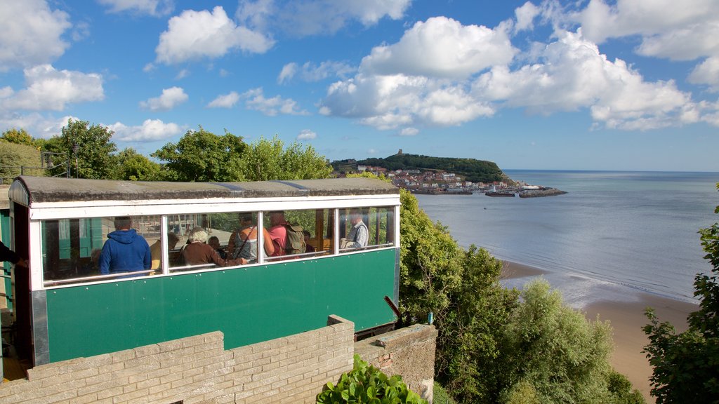 Scarborough Spa showing general coastal views and a day spa as well as a small group of people