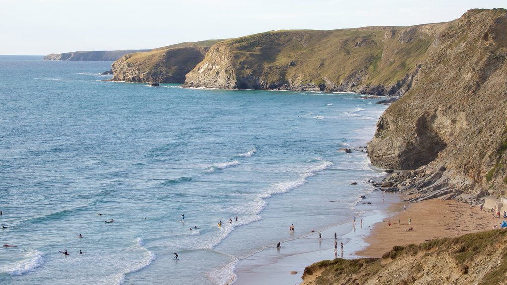 Watergate Bay showing a sandy beach and rugged coastline