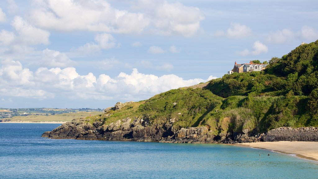 Porthminster Beach featuring a sandy beach and a coastal town