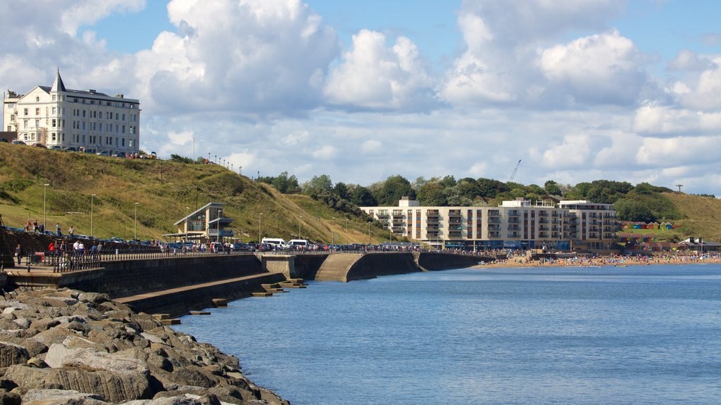 North Bay Beach which includes a coastal town, rocky coastline and a beach