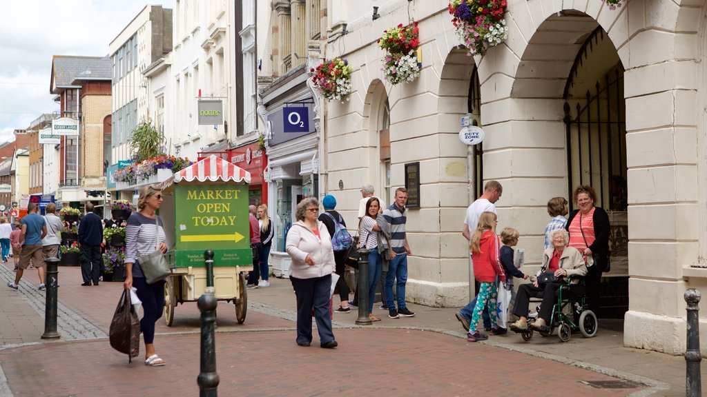 Pannier Market featuring signage and markets as well as a large group of people