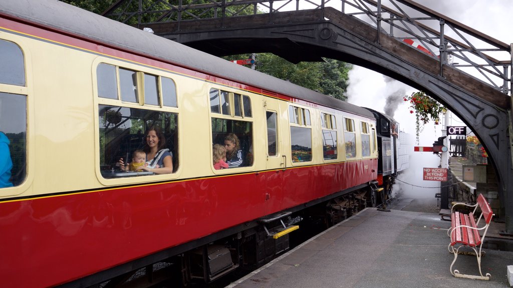 Cumbria featuring railway items and heritage elements as well as a small group of people