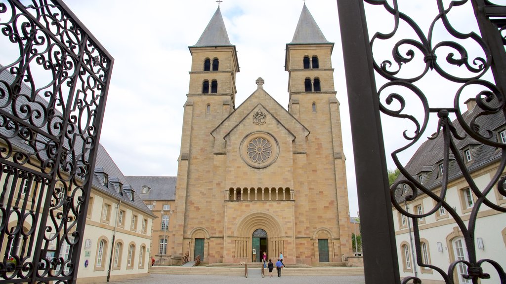 Echternach which includes a church or cathedral as well as a small group of people