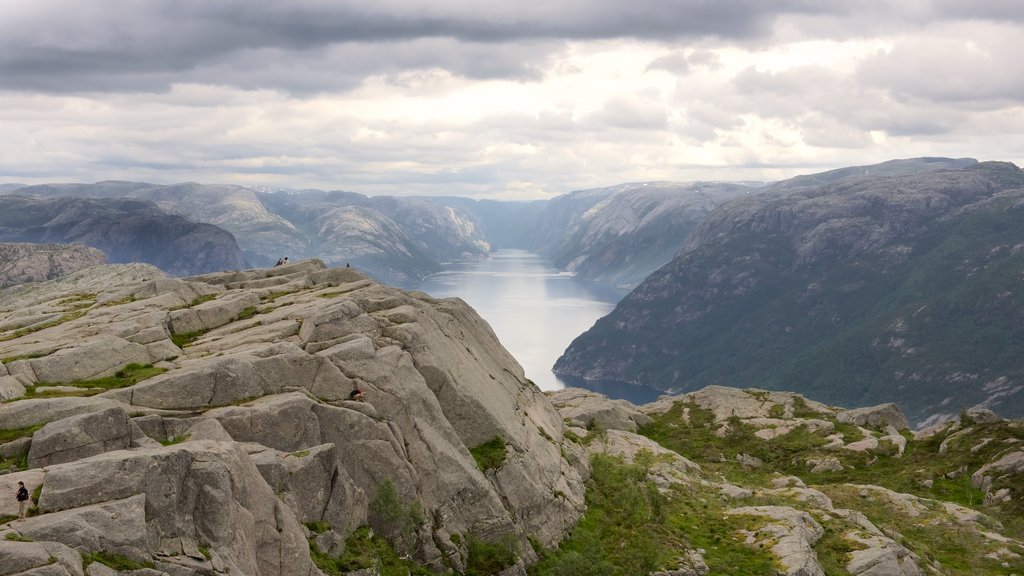 Preikestolen showing a lake or waterhole and mountains