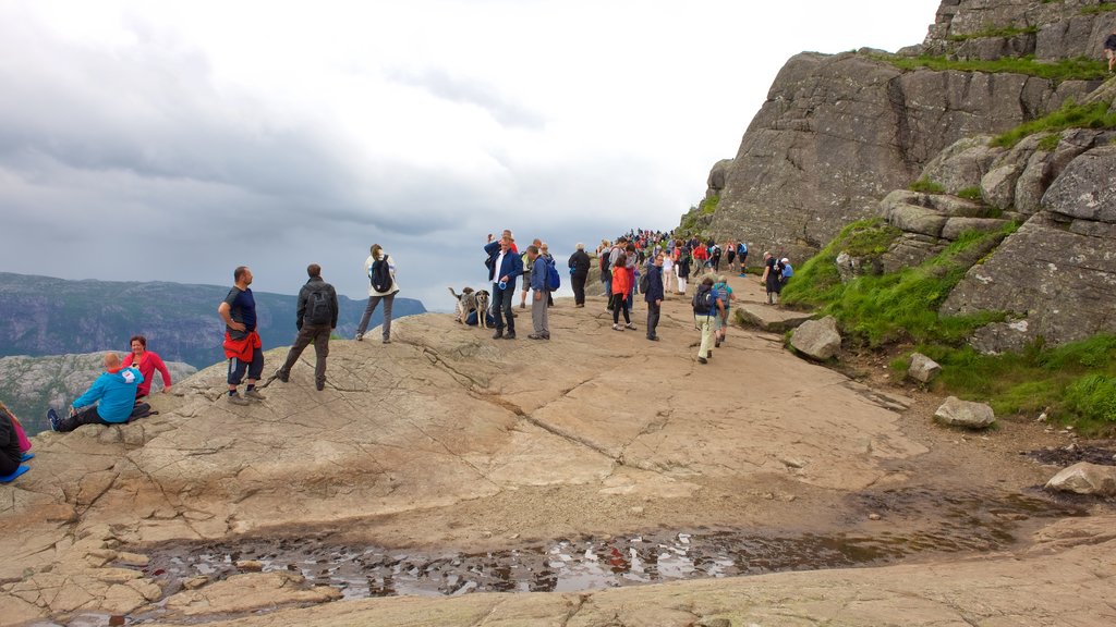 Preikestolen featuring hiking or walking as well as a large group of people