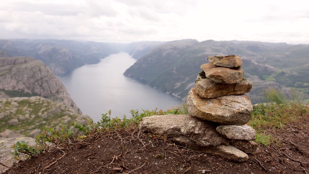 Preikestolen showing a lake or waterhole and mountains