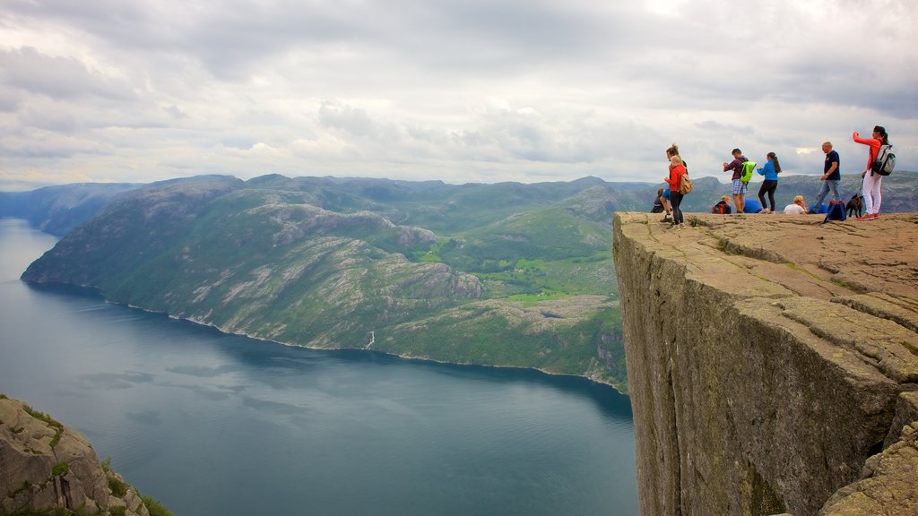 Preikestolen showing mountains, views and a lake or waterhole