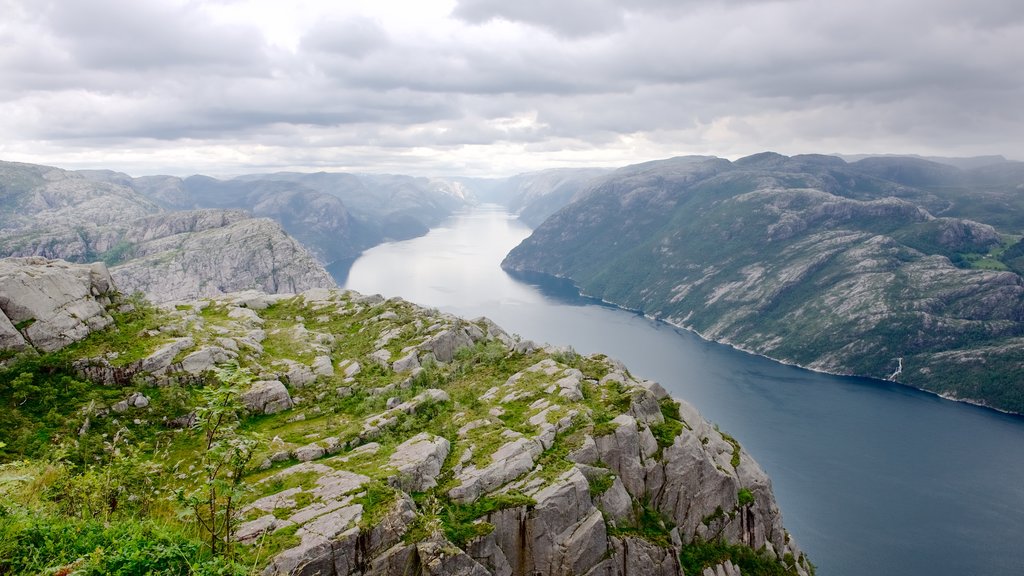 Preikestolen showing a lake or waterhole, mountains and landscape views