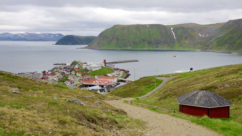 Honningsvag which includes a coastal town, mountains and general coastal views