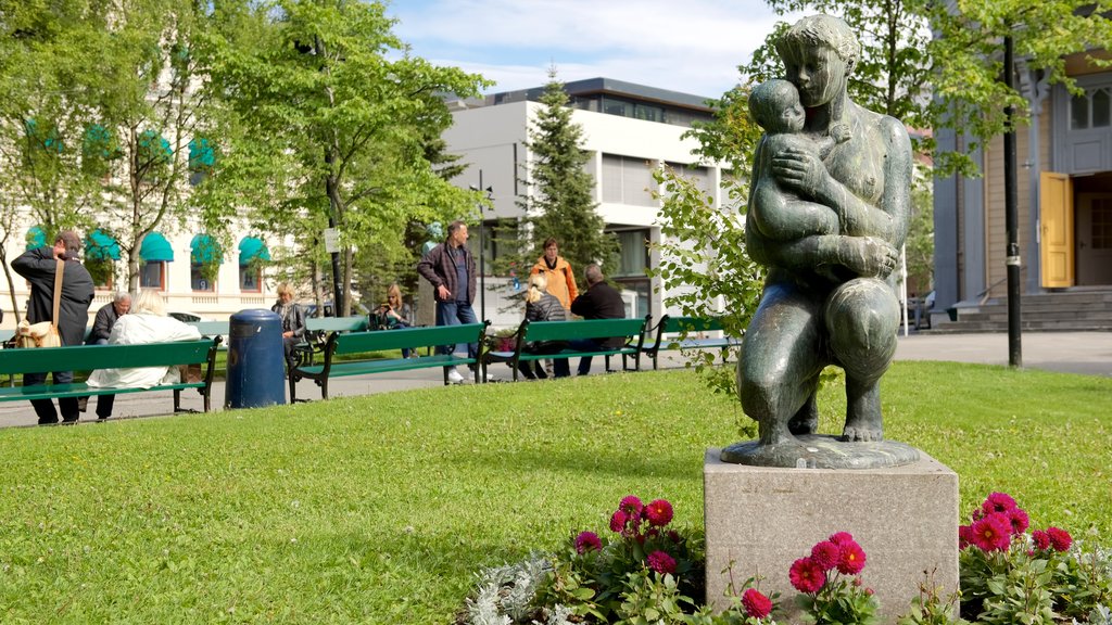 Tromso Cathedral which includes a statue or sculpture and a garden