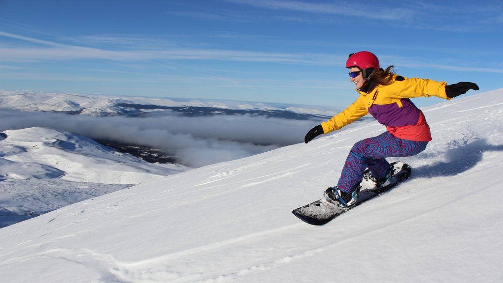 Cairngorm Ski Resort which includes snowboarding and snow as well as an individual female