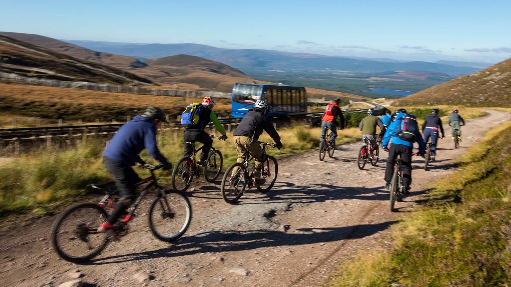 Cairngorm Ski Resort featuring railway items and mountain biking as well as a large group of people