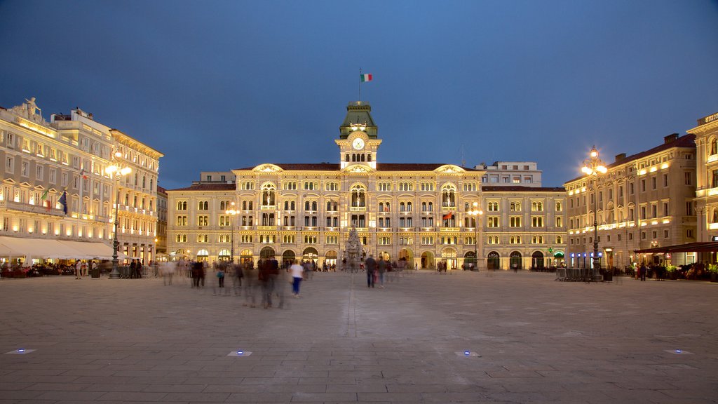 Piazza dell\'Unita featuring a square or plaza, an administrative building and night scenes