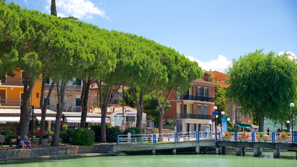 Passignano sul Trasimeno which includes a river or creek and a bridge