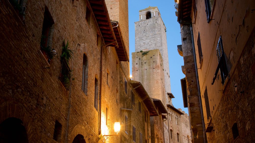 San Gimignano which includes heritage architecture and night scenes