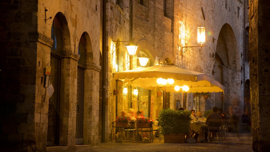 San Gimignano which includes night scenes, café lifestyle and dining out