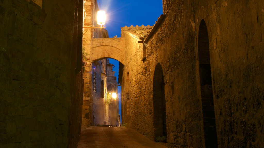 San Gimignano showing night scenes, heritage architecture and a small town or village