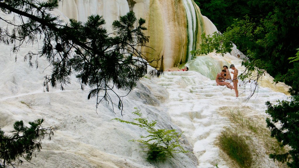 Bagni San Filippo showing a hot spring as well as a small group of people