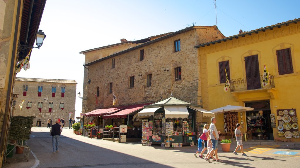 Massa Marittima which includes street scenes and markets as well as a small group of people