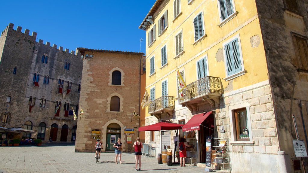 Massa Marittima which includes heritage architecture as well as a small group of people