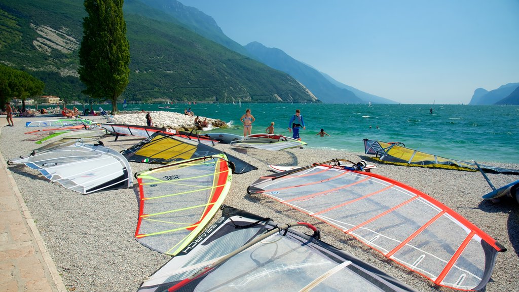 Nago-Torbole which includes a pebble beach and windsurfing as well as a large group of people