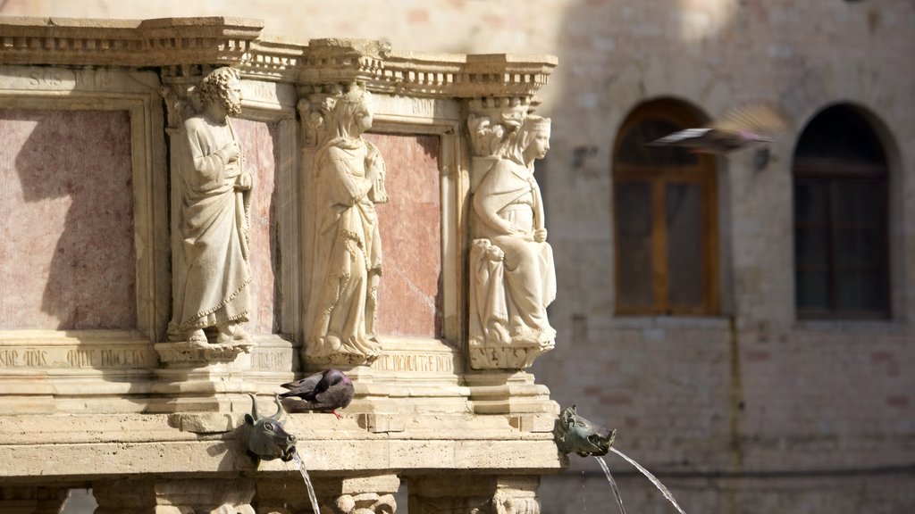 Fontana Maggiore showing heritage architecture and a monument