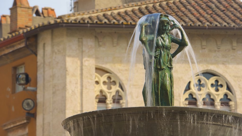 Fontana Maggiore caracterizando uma estátua ou escultura e uma fonte