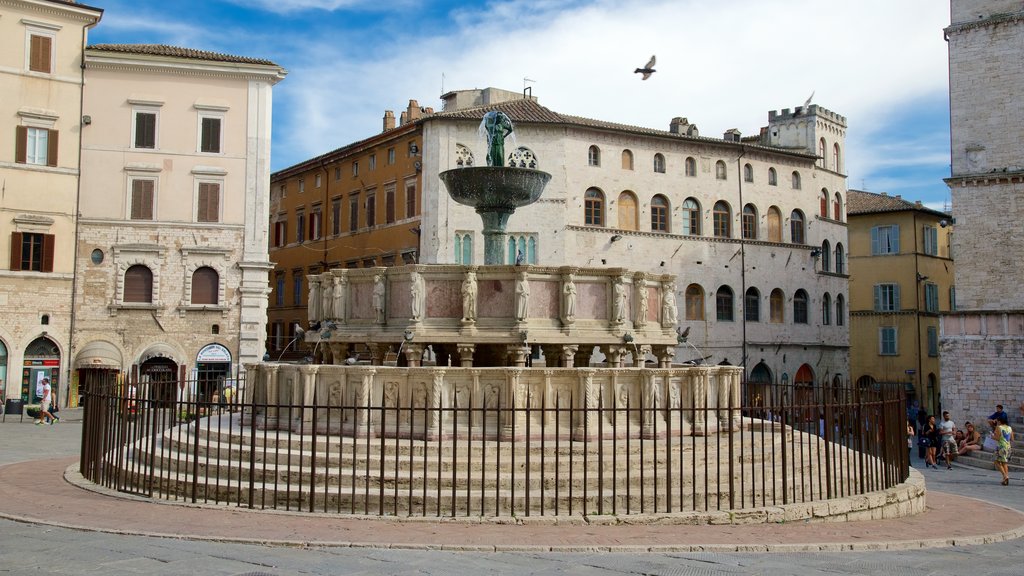 Fontana Maggiore que inclui uma fonte, arquitetura de patrimônio e uma praça ou plaza