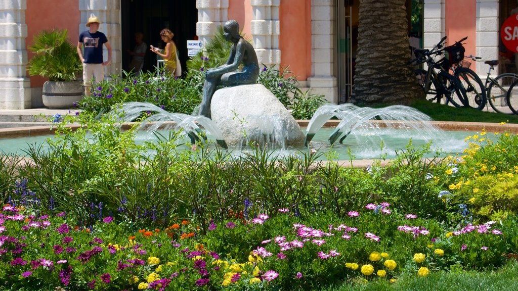 Trentino ofreciendo una fuente y flores