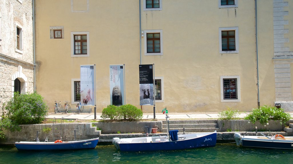 Trentino featuring a lake or waterhole, boating and heritage architecture