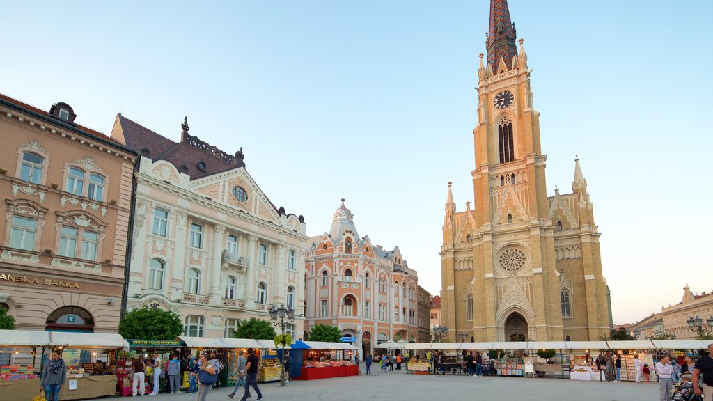 Igreja da Virgem Maria mostrando uma igreja ou catedral, uma praça ou plaza e cenas de rua