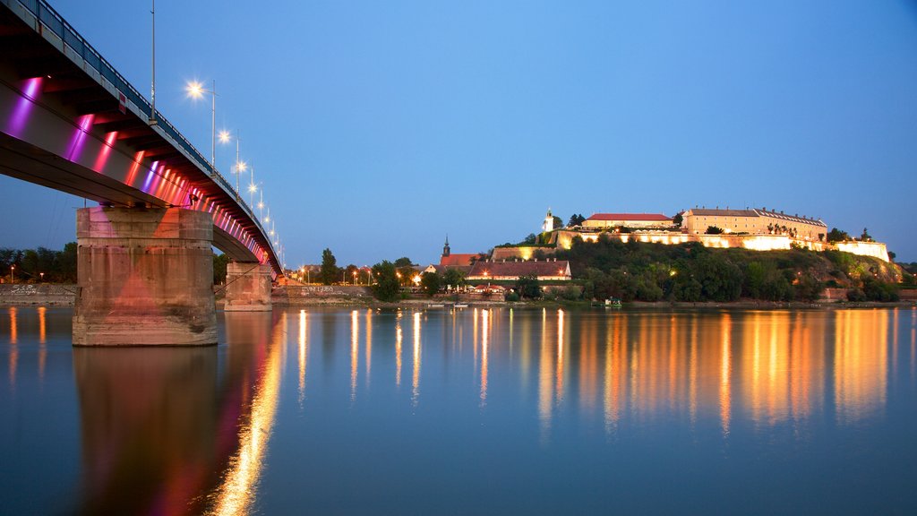 Petrovaradin Fortress featuring a river or creek, a bridge and night scenes