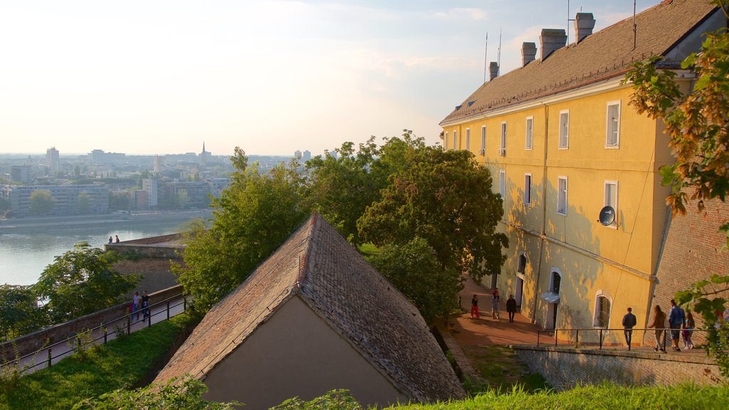 Petrovaradin Fortress showing a river or creek, a city and heritage architecture