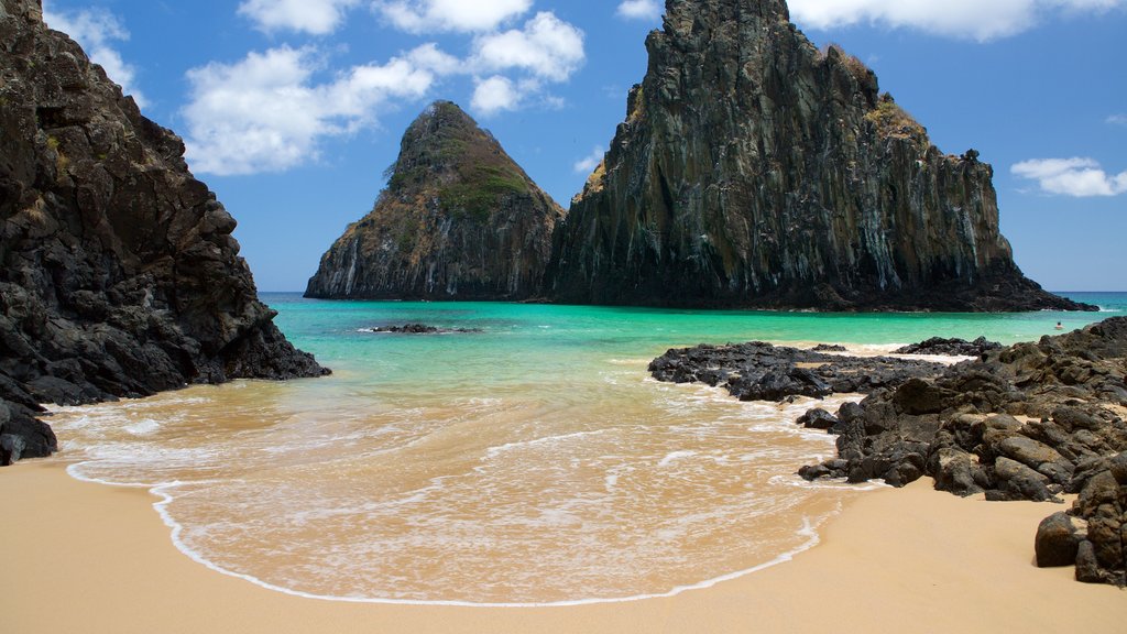 Dois Irmaos Hill showing general coastal views, mountains and a sandy beach