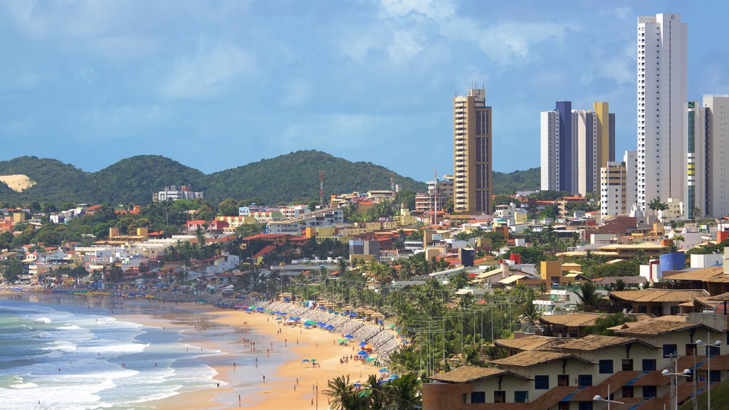 Ponta Negra Beach which includes a sandy beach, a coastal town and a high rise building