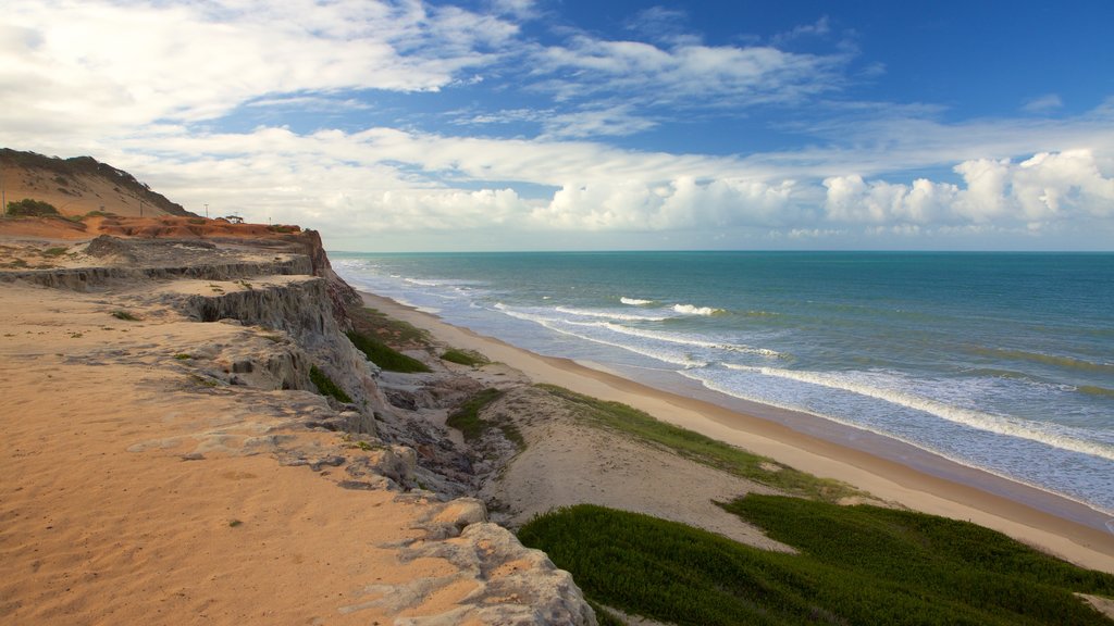 Pipa which includes rocky coastline, general coastal views and a sandy beach