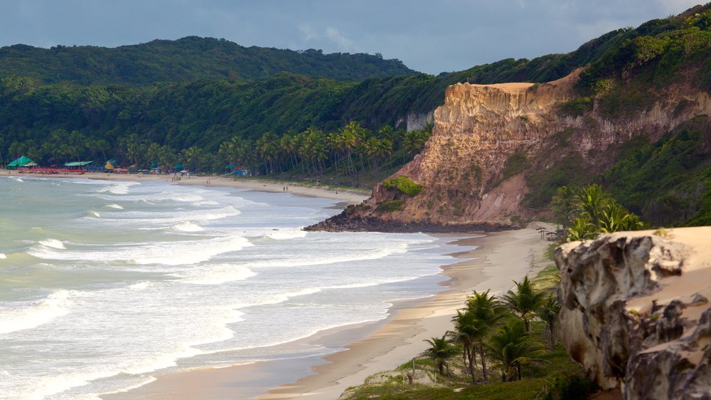 Pipa which includes rugged coastline, general coastal views and a sandy beach