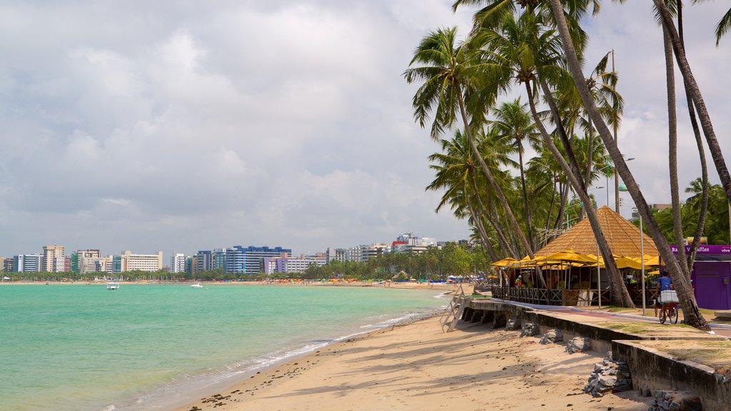 Ponta Verde Beach showing a coastal town, general coastal views and a beach