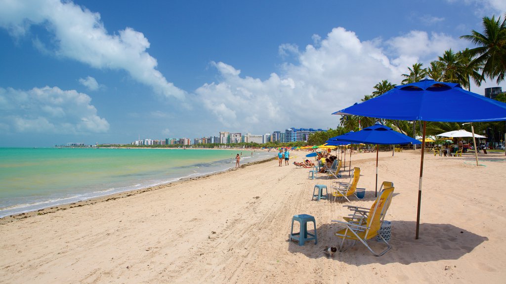 Pajucara Beach which includes general coastal views, a coastal town and a sandy beach