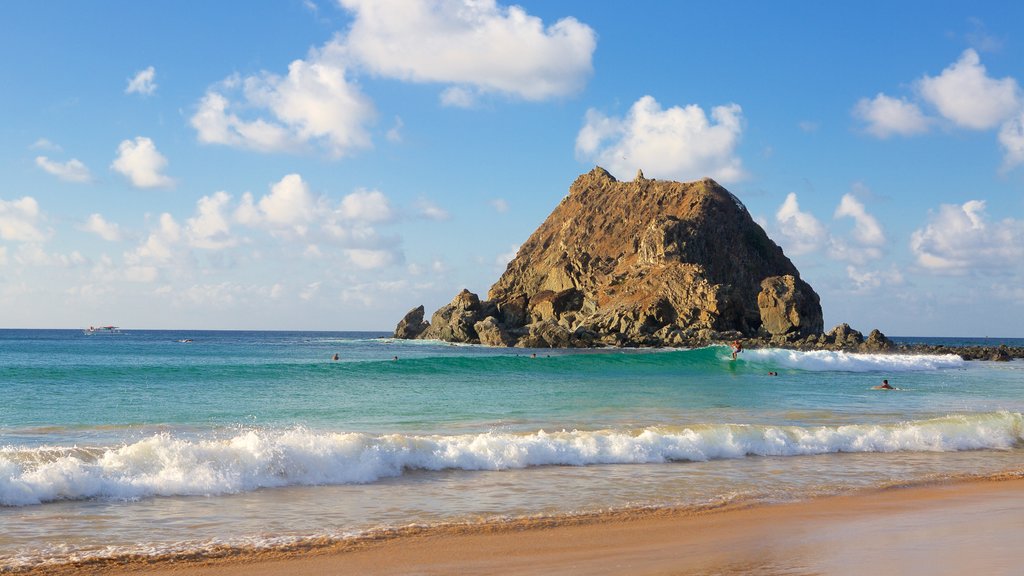 Conceicao Beach featuring a sandy beach, waves and general coastal views