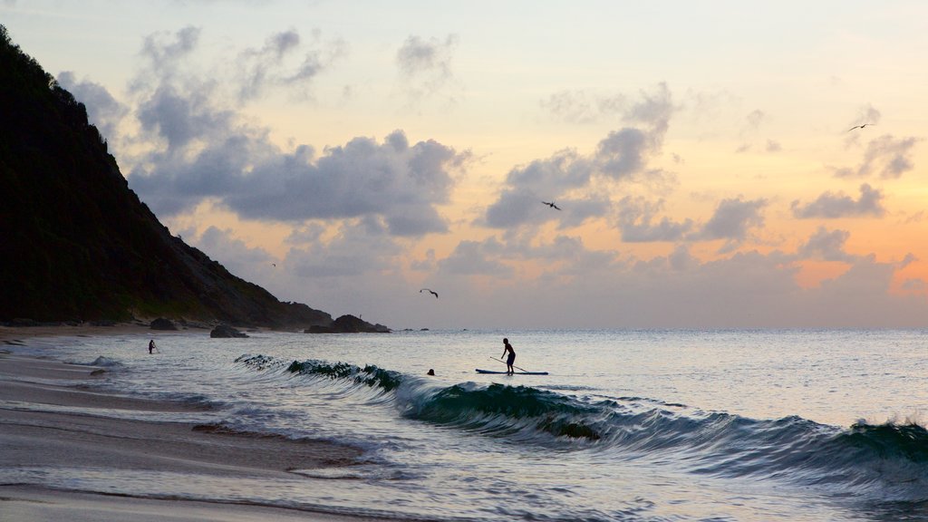 Conceicao Beach which includes general coastal views, a sunset and water sports