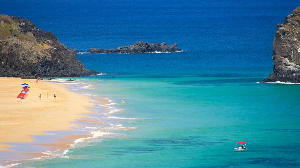 Fernando de Noronha which includes a sandy beach, a bay or harbour and general coastal views