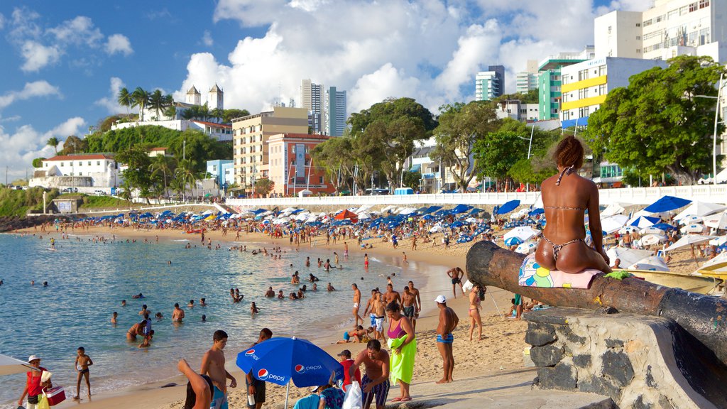 Porto da Barra Beach showing a sandy beach, a coastal town and general coastal views