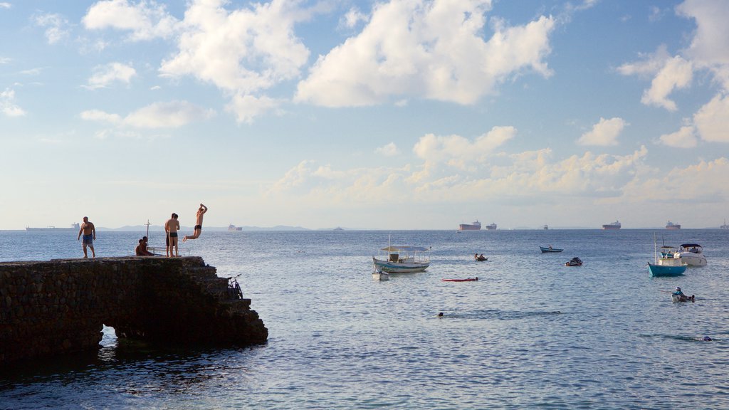 Porto da Barra Beach showing general coastal views, swimming and boating