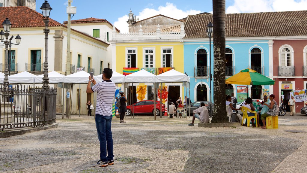 Terreiro de Jesus showing street scenes and a square or plaza as well as an individual male