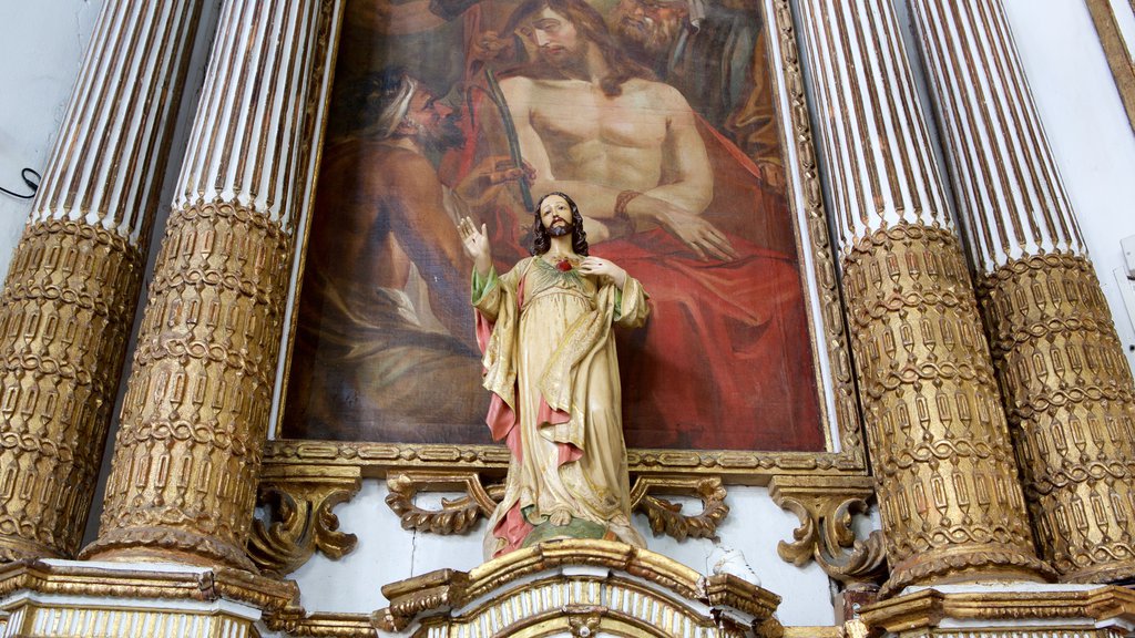 Church of Nosso Senhor do Bonfim showing a statue or sculpture, art and religious elements