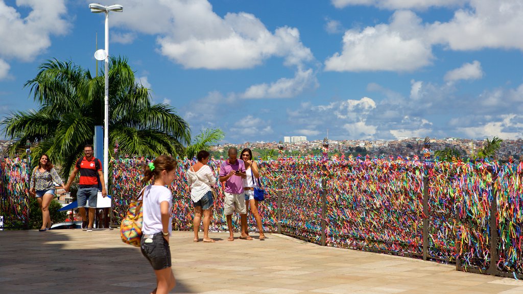 Church of Nosso Senhor do Bonfim which includes religious elements and a church or cathedral as well as a small group of people