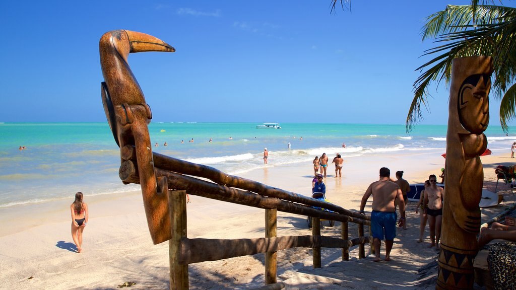 Playa Ipioca que incluye una playa de arena, escenas tropicales y natación