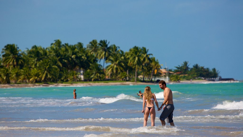 Ipioca Strand mit einem allgemeine Küstenansicht, tropische Szenerien und Schwimmen