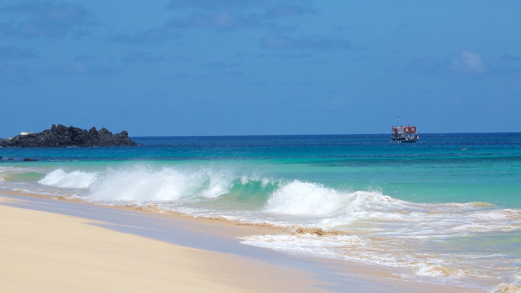 Cacimba do Padre Beach which includes a sandy beach, general coastal views and surf